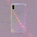 Silver glossy laser design silicone case for iPhone on a table.