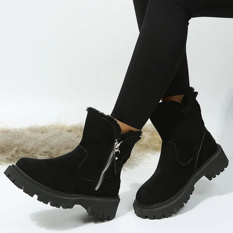 Women's black thick plush snow boot with side zipper and round toe on a rubber sole.