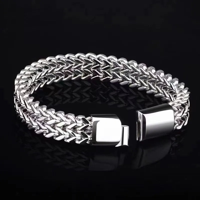 Silver stainless steel men's bracelet with geometric links, shown in 4x8mm and 5x10mm sizes on a wrist.