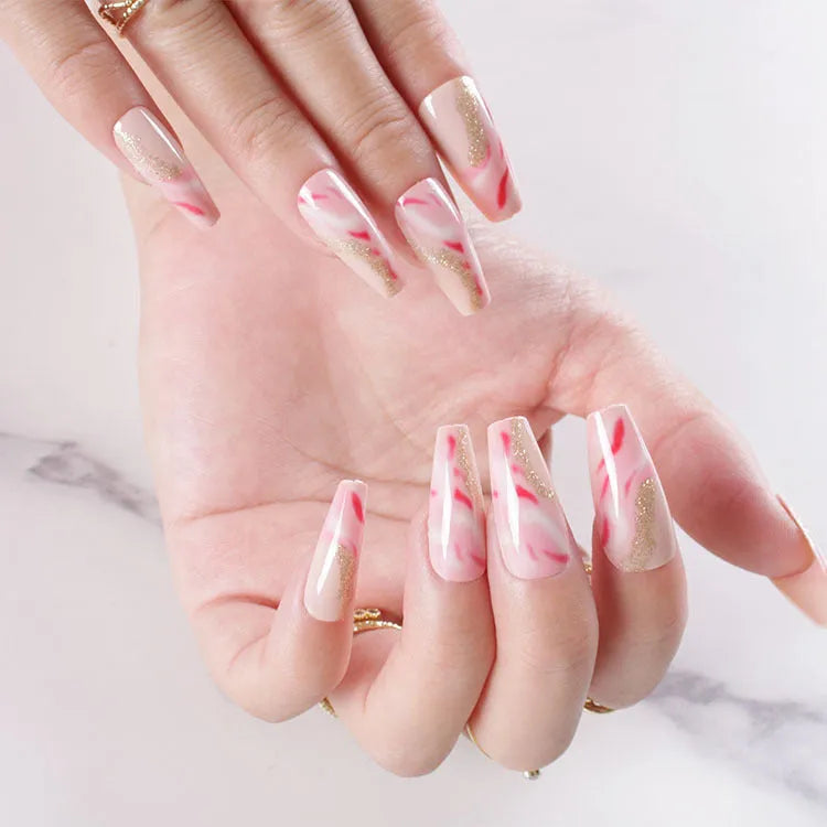 Set of medium-length false nails showing rose, tulip, leopard print, and XINGX patterns with glue.
