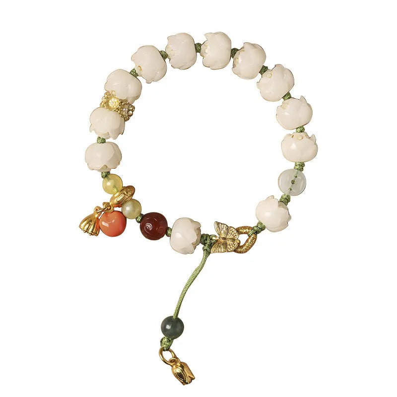 White jade Bodhi bracelet with lotus beads and a large pumpkin bead on an open rope.