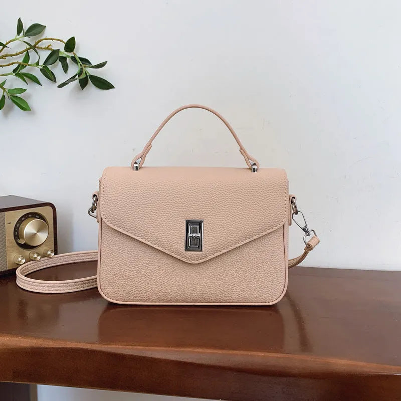 Fashion casual all-match commute cowhide portable shoulder messenger bag in PU leather with sewing thread detail