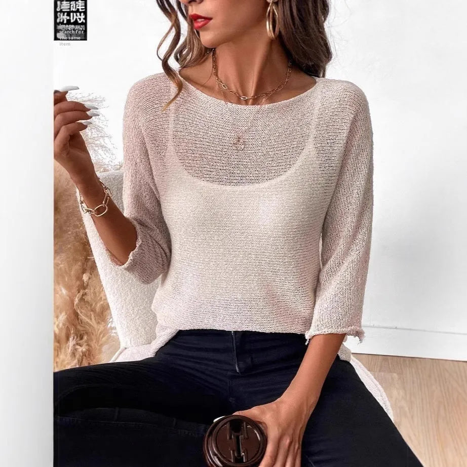 Women's thin off-shoulder knitted jumper in lavender purple with three-quarter sleeves.