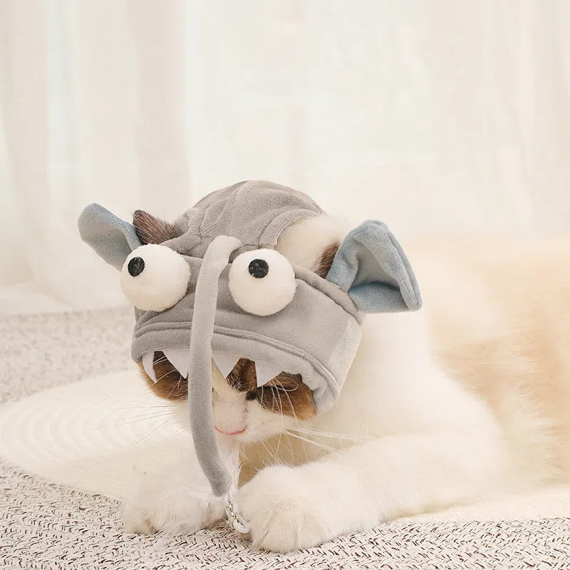 Grey cat teaser toy with adjustable headband, feather decoration, and big eye fish design