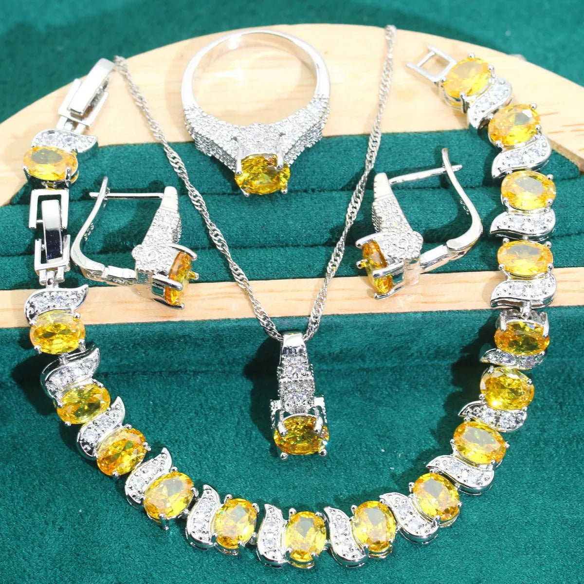 Bridal four-piece jewellery set showing necklace, earrings, ring and bracelet with water wave chain design