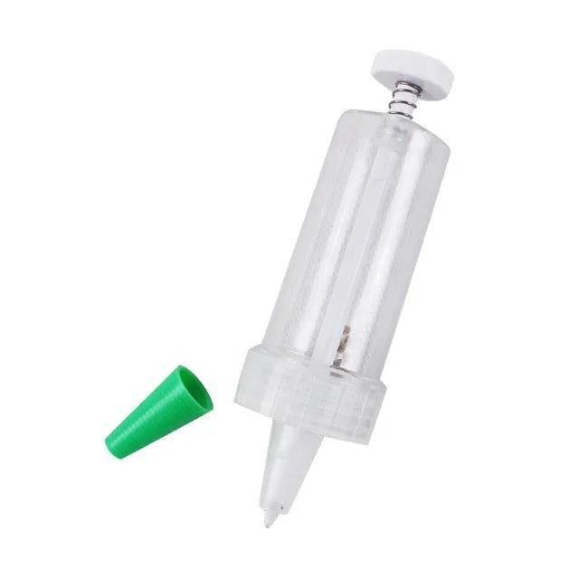 A 12cm long, 3cm diameter plastic mini garden seeder tool for dispensing seeds into pots.