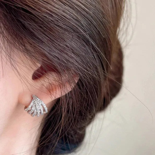 A pair of women's geometric line design earrings in platinum-finished zircon.