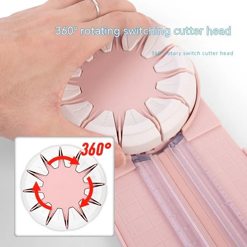 Pink and black 12-in-1 multifunctional plastic paper cutting machine on a white background.
