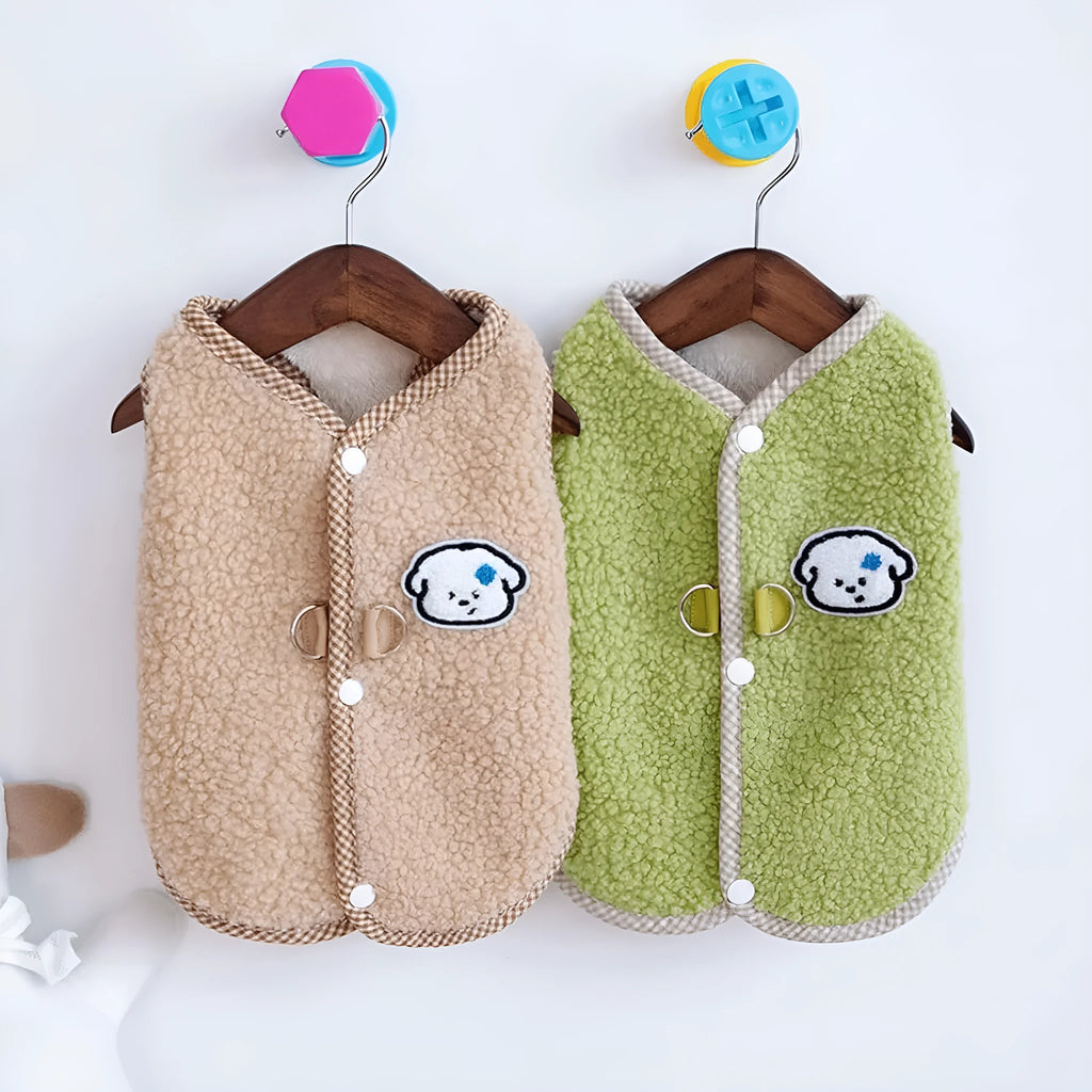 Green coral fleece dog vest with a leash ring on a small dog, showing the sleeveless design.