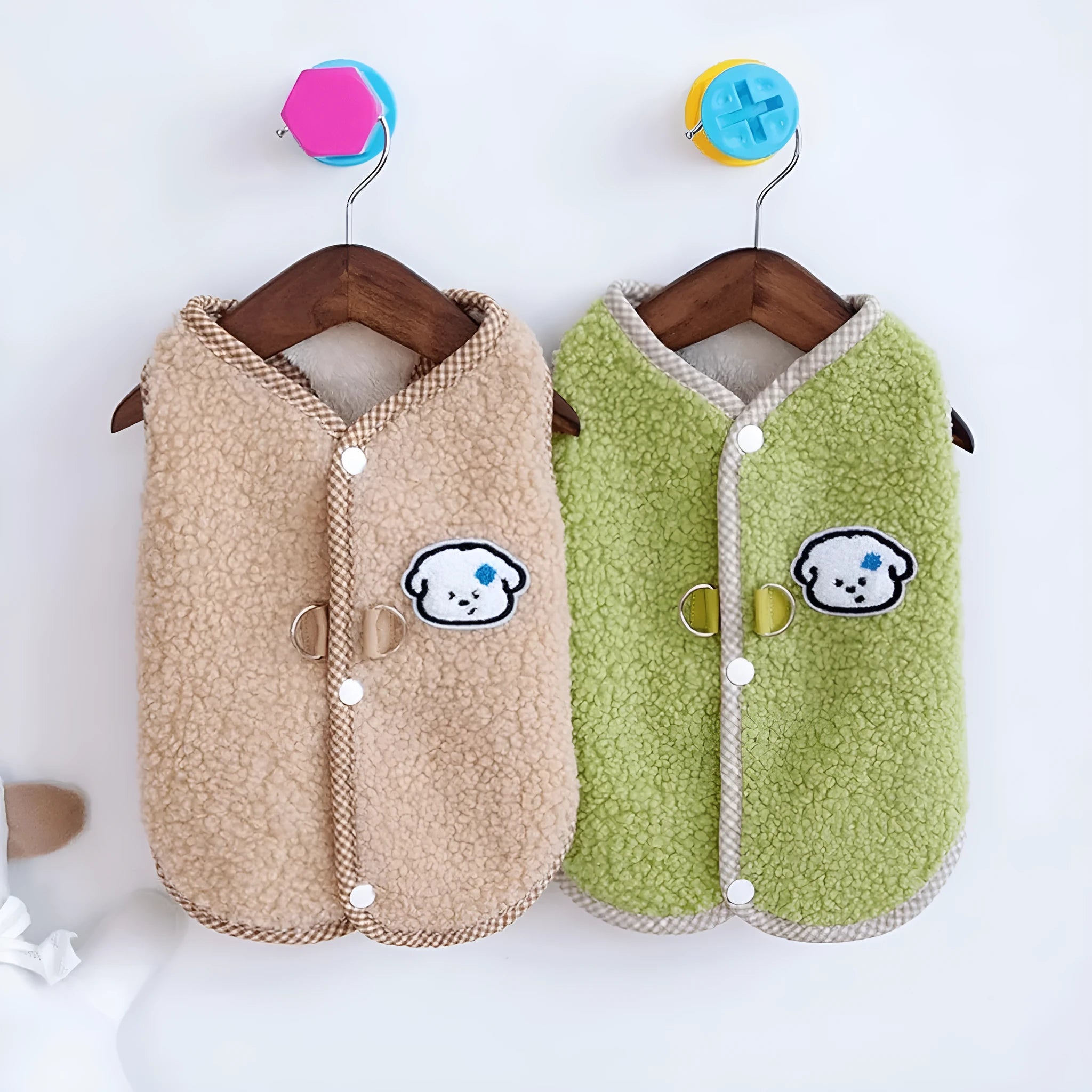 Green coral fleece dog vest with a leash ring on a small dog, showing the sleeveless design.