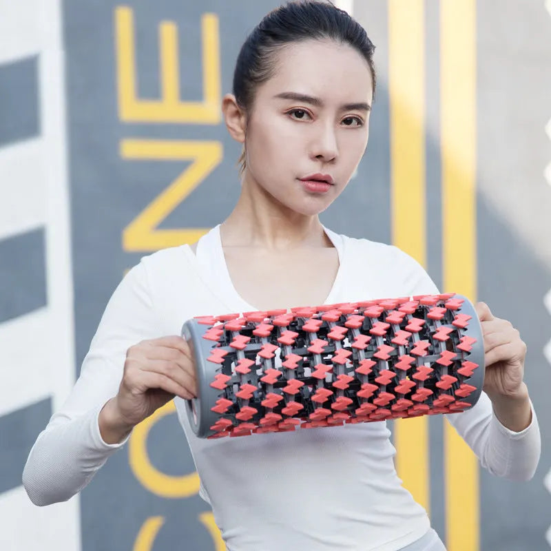 Adjustable telescopic foam roller for muscle massage in red, black, pink, or yellow colour options.