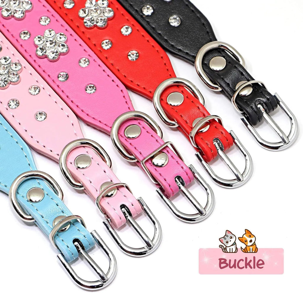Close-up of a black PU leather dog collar with sparkling rhinestone flower studs and a metal D-ring