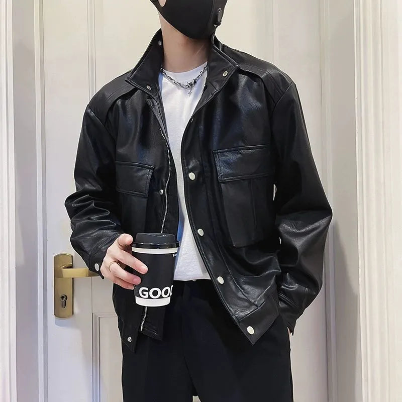 Man wearing a black PU leather pilot-style jacket with side pockets and a straight hem.