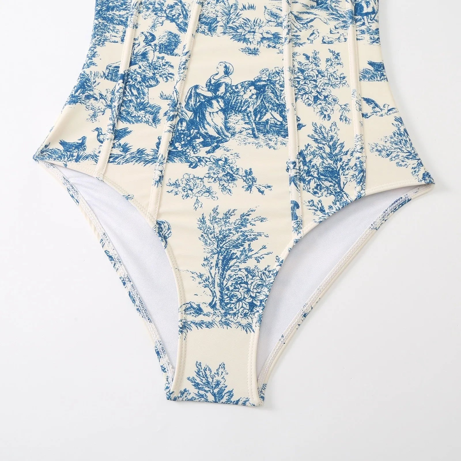 Blue women's one-piece polyester swimsuit with a separate matching gauze skirt.