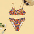 Plus size women's floral print strap bikini swimsuit two-piece set on a mannequin