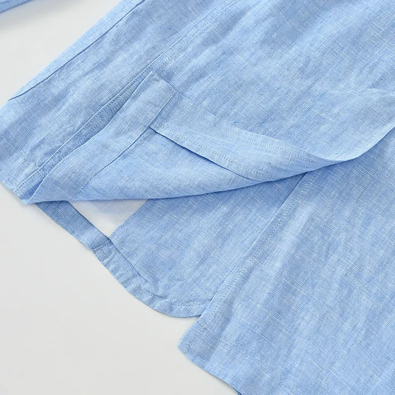 Men's solid colour linen suit blazer with side stick pockets, shown in light blue.