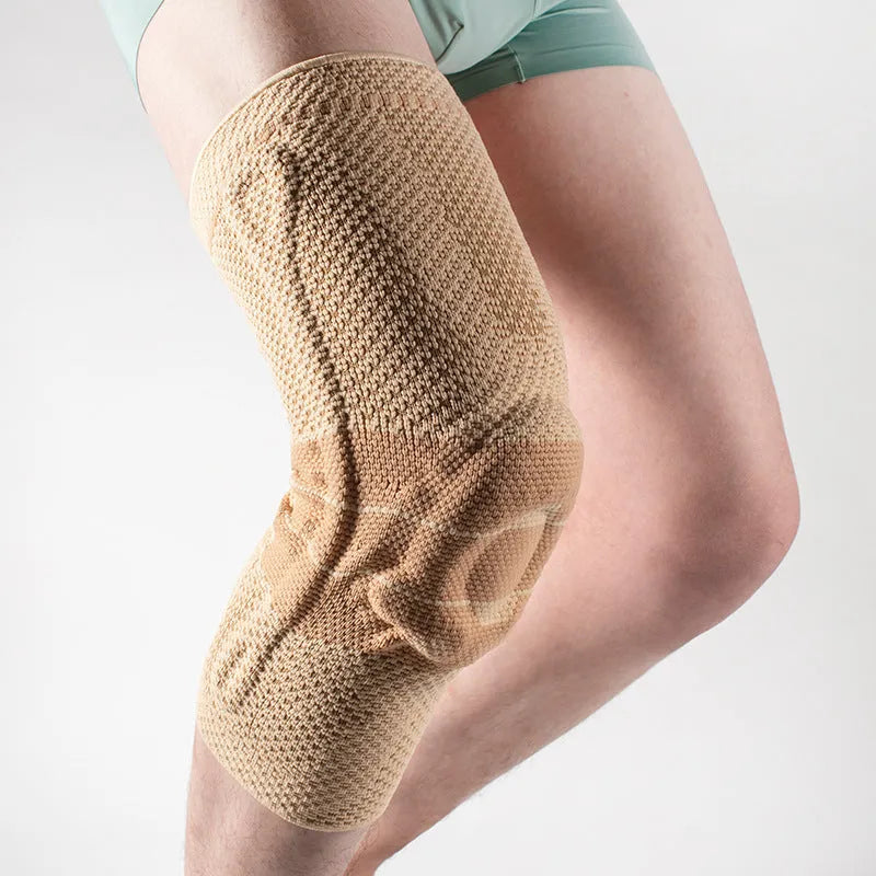 Adult sports knee pad in black and blue, made from nylon and spandex.