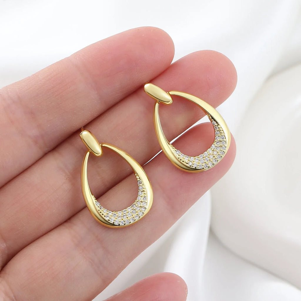 Women's yellow gold geometric drop earrings with 2.6cm length and round ring design elements