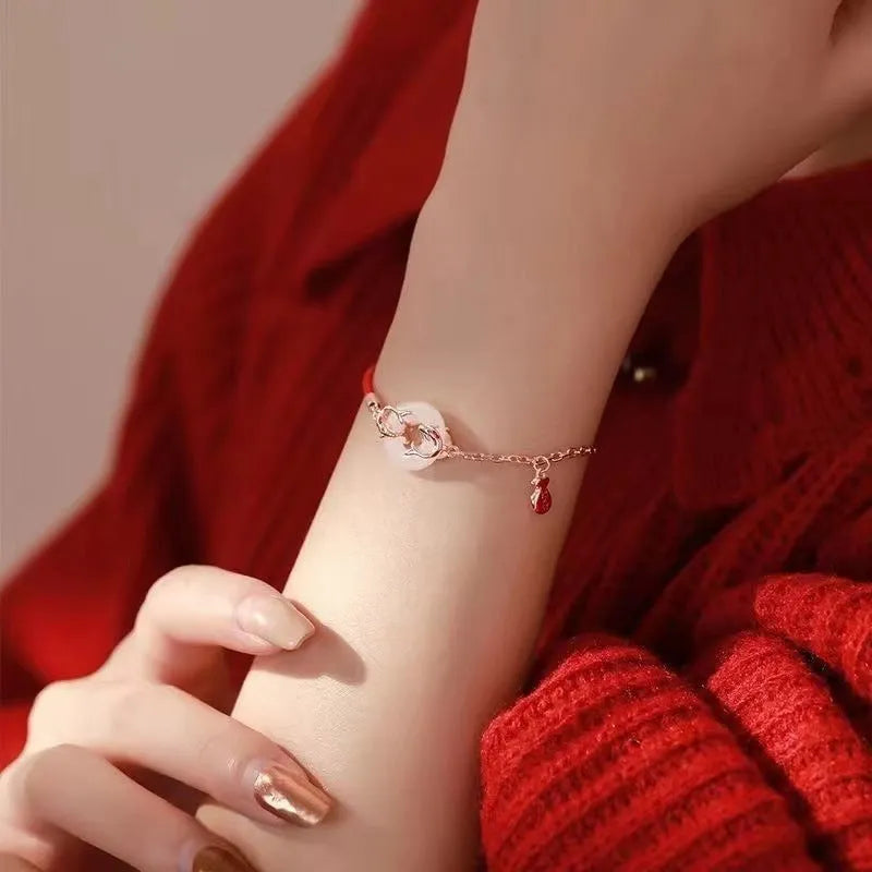 Women's festive koi design bracelet with a peace buckle and red rope, Japanese Korean style.