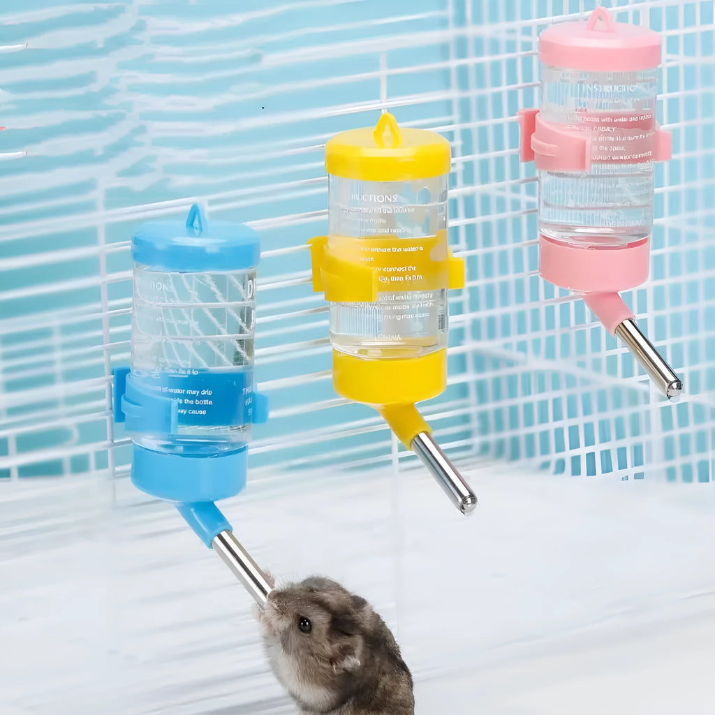 Green plastic ball kettle water feeder for small pets, shown attached to a cage.