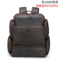 Dark brown retro crazy horse leather backpack for men open to show 17-inch laptop compartment and internal organisers.