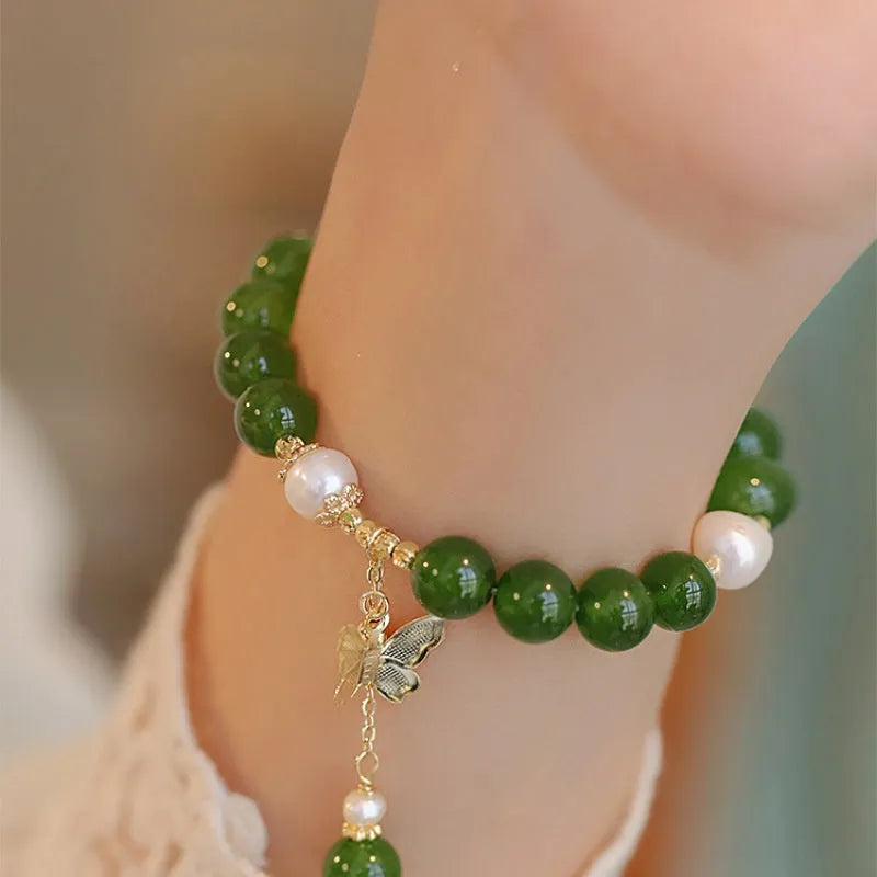 Women's natural green chalcedony bracelet with round geometric beads and handmade craft details