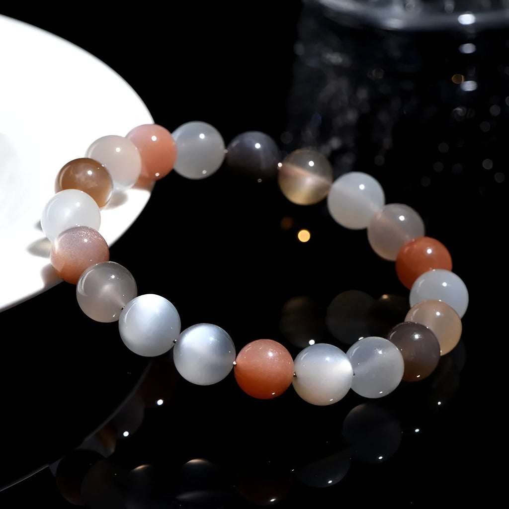 Natural colourful moonlight bracelet with 8mm moonstone beads on a wrist.