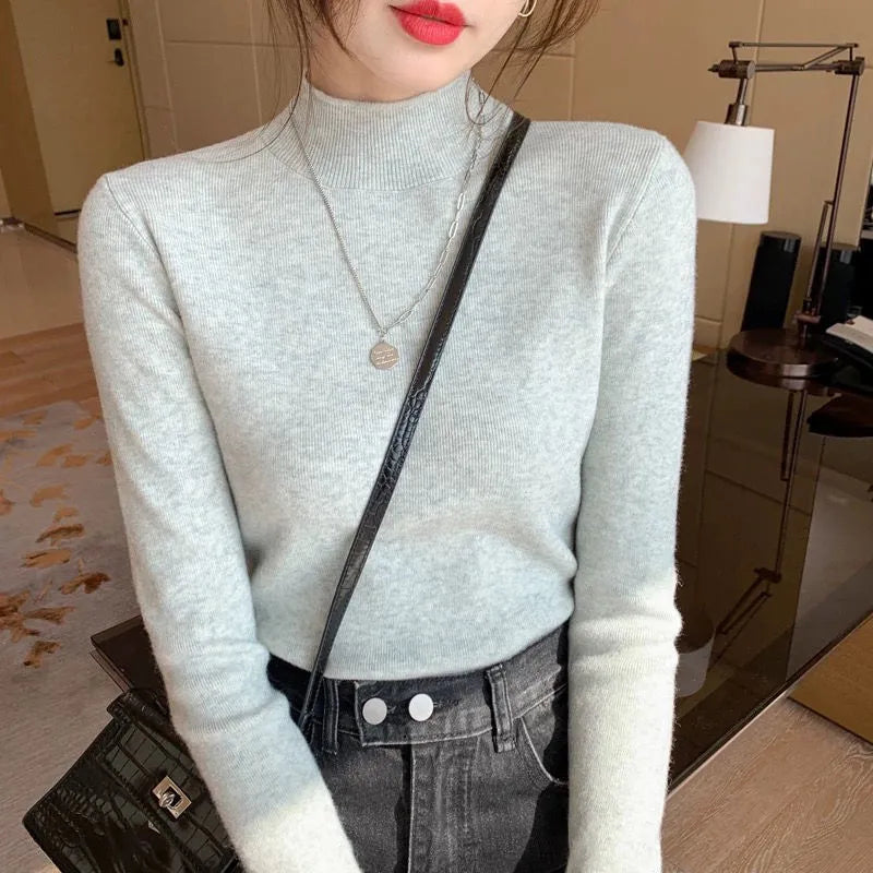 Slim fit viscose long sleeve top in apricot colour showing inner knitted bottoming detail.