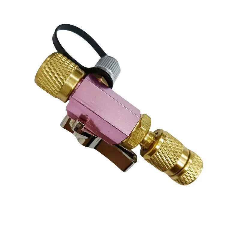 Bicycle tyre valve core removal tool set showing black and pink metal tools for 1/4-inch and 5/16-inch valves