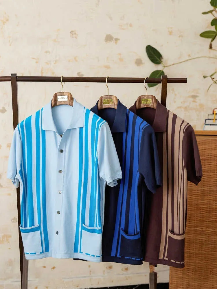 A thin, short-sleeved striped cardigan polo shirt with a lapel collar in a light blue colour.