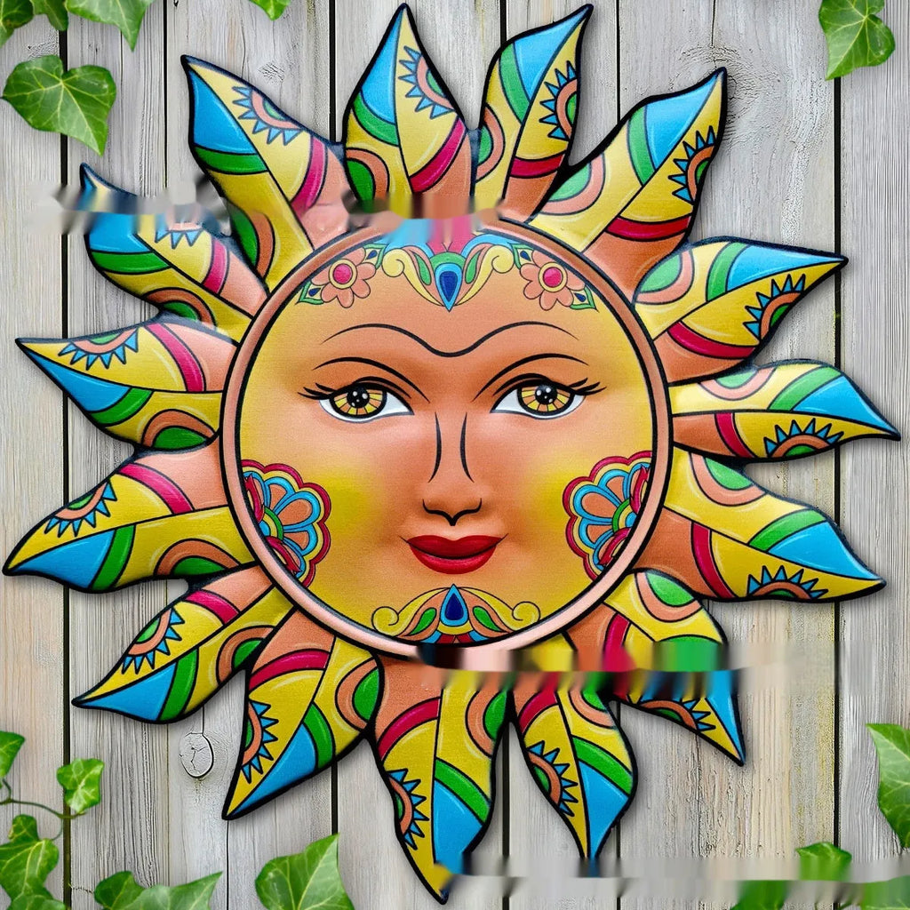 Circular iron sun face metal wall hanging with radiating rays, shown in a gold finish.