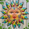Circular iron sun face metal wall hanging with radiating rays, shown in a gold finish.