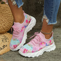 Women's floral print canvas walking sneakers with lace-up closure and rubber sole in pink