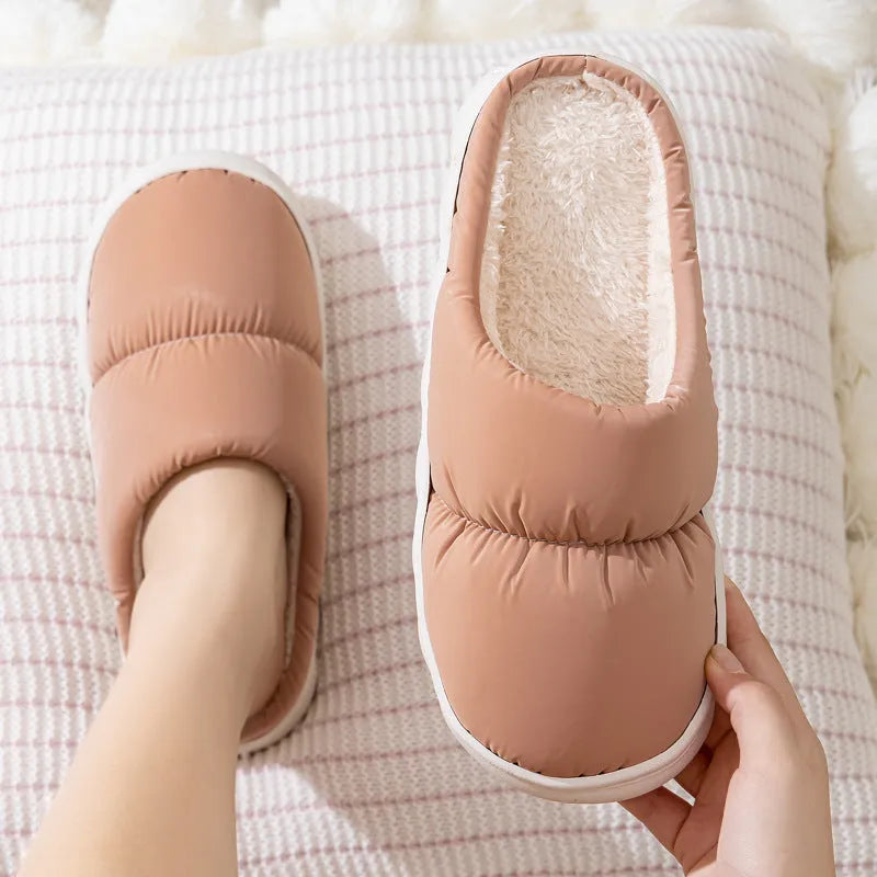 Down cotton house slippers with artificial leather upper, rubber sole, and plush lining in blue colour