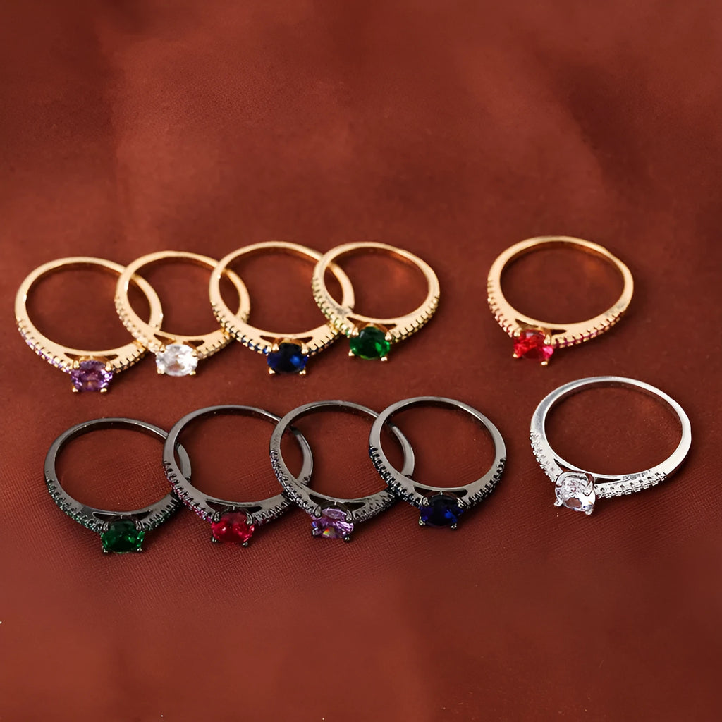Geometric hexagon zircon ring in copper on a grey background, showing electroplated gold rose red finish.