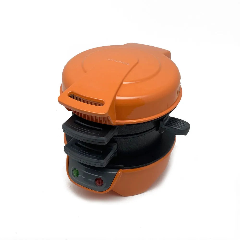 Bright red breakfast sandwich maker with egg cooker ring and waffle plate on kitchen counter