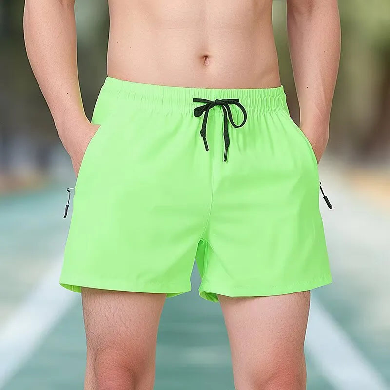Black micro-elastic polyester training shorts with high waist and drawstring closure