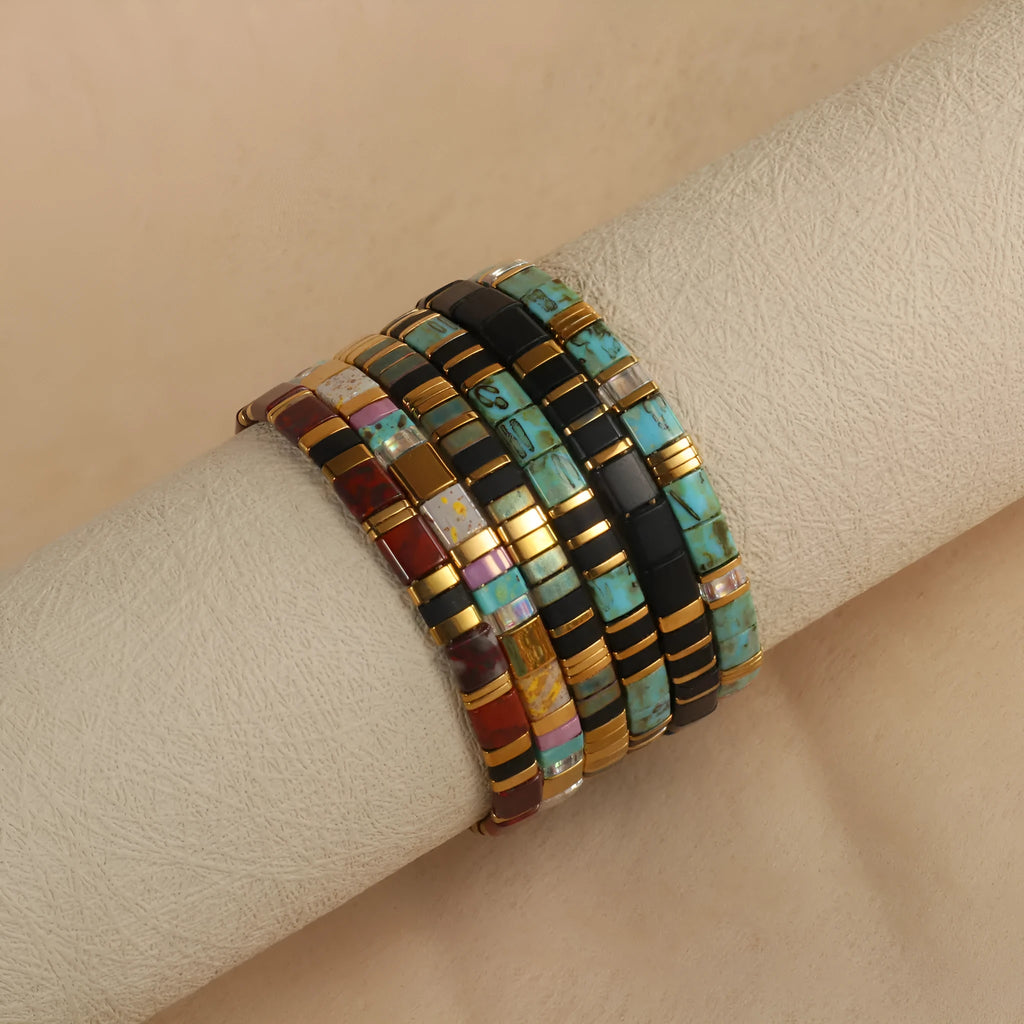 Geometric glass bead bracelet in milky white, black, retro green, light blue, or red colours.