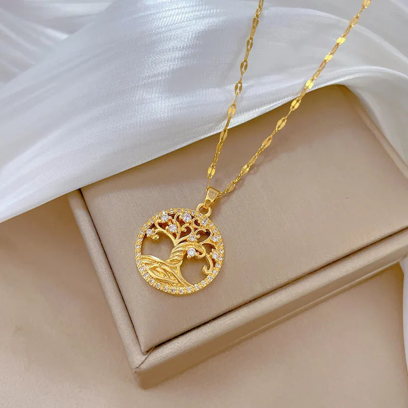 Gold-plated cross necklace with a mother pearl pendant, detailed rhinestones, and an adjustable lip chain.
