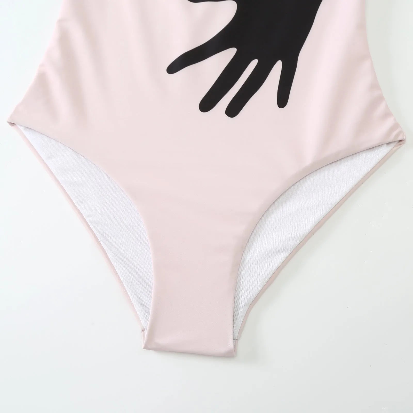 Women's patterned one-piece bikini with a matching lightweight tulle skirt.