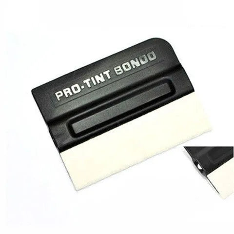 Car film application scraper tool with magnetic head and ABS handle on a work surface.