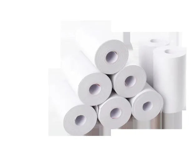 Bluetooth mini thermal photo printer in pink with USB cable and paper rolls on a white background
