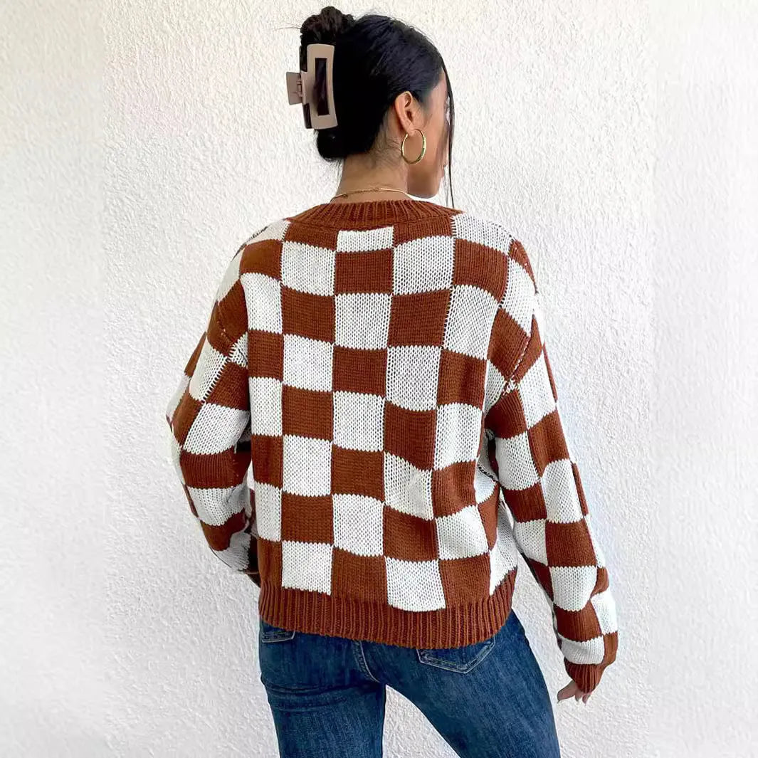 Dark brown loose pullover sweater with a chessboard plaid pattern and round neck.