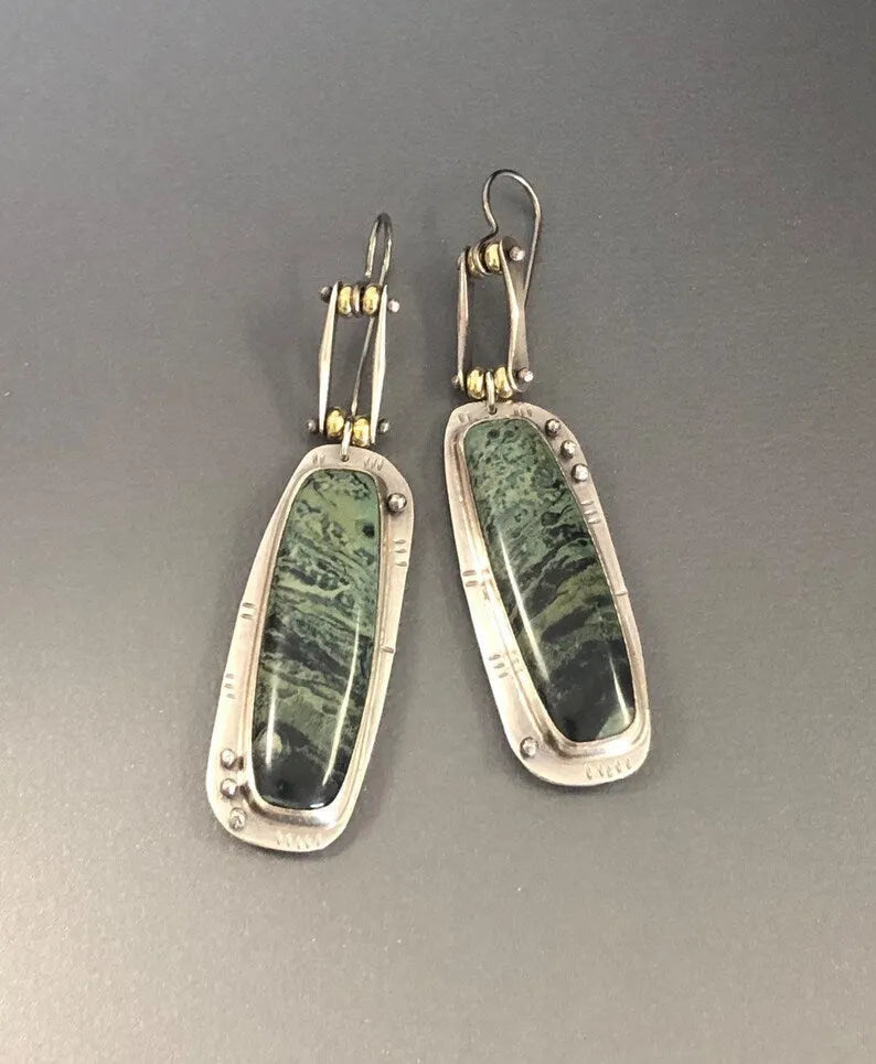 Geometric alloy earrings with two-colour marble pattern and simple styling