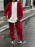 Street style loose fit two-piece set with long-sleeved coat and matching trousers in solid colour