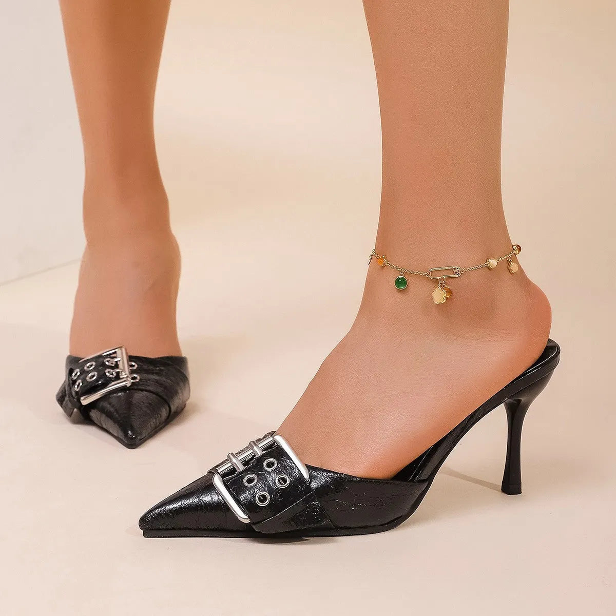 Black women's pointed toe high heels with ankle strap and buckle decoration