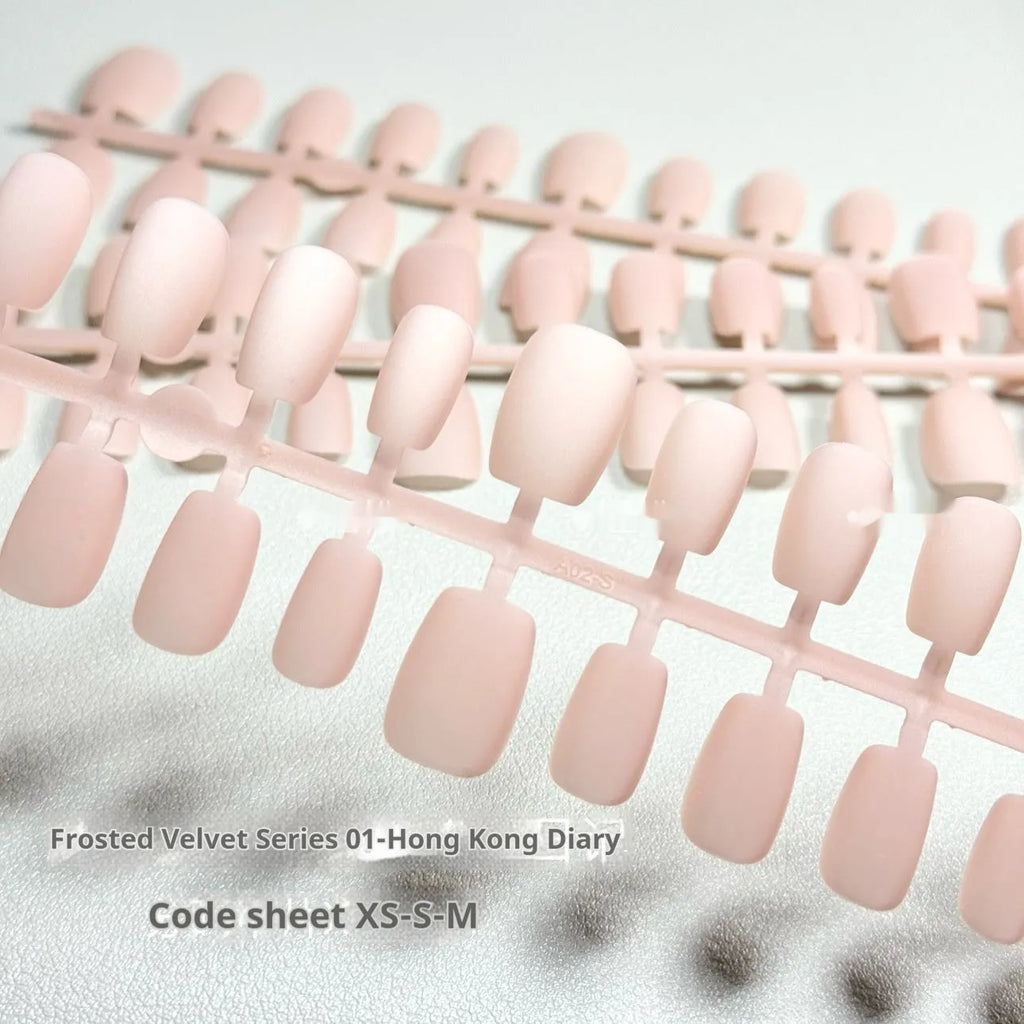 Frosted Velvet Cat's Eye press-on artificial nails showing Aurora and solid colour designs in short ladder shapes.