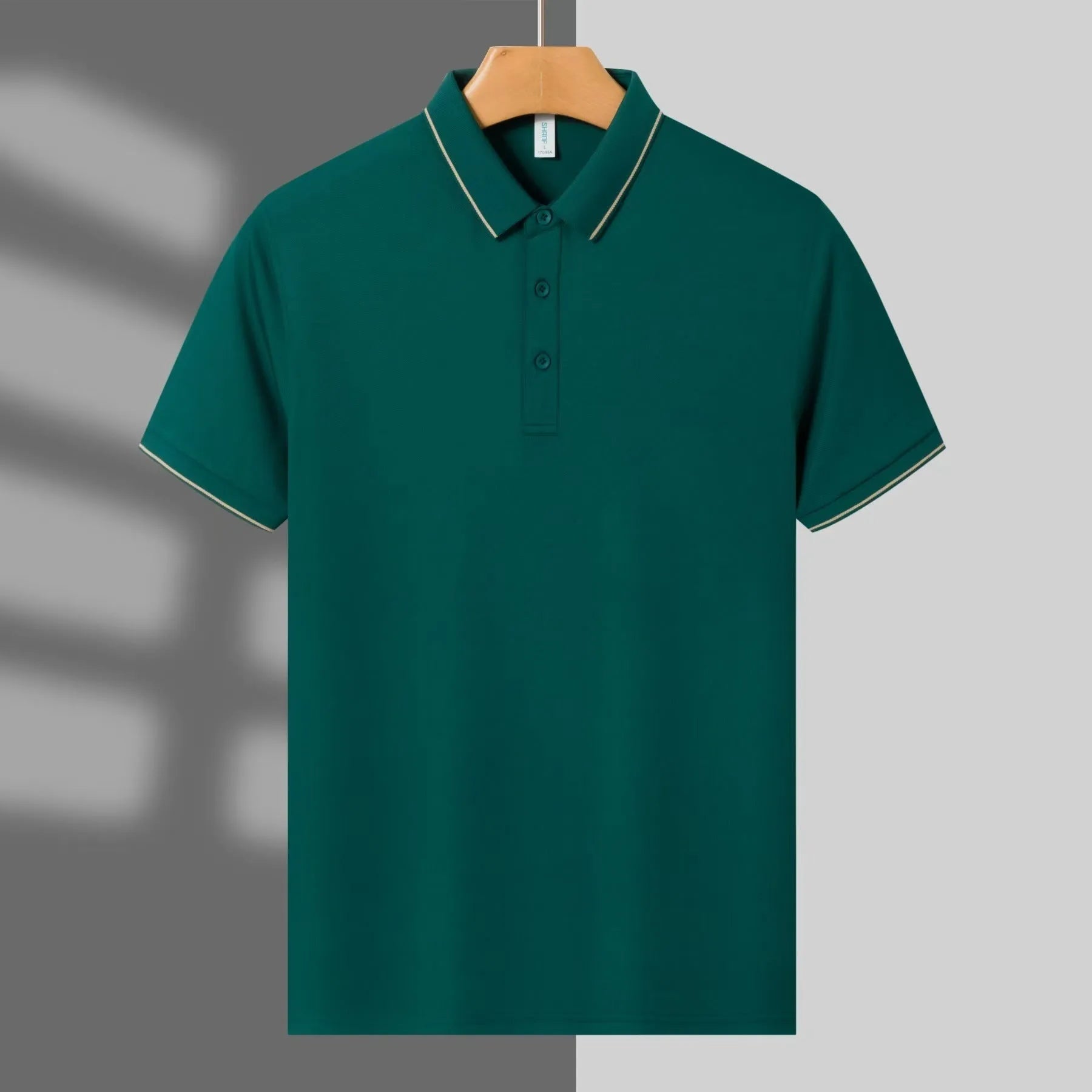 Men's light green loose-fit polo shirt with short sleeves and a single collar lapel, laid flat.