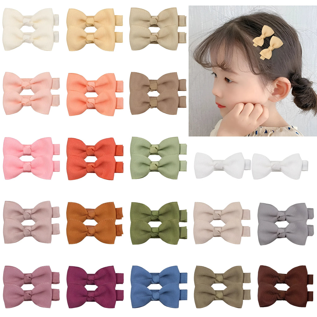 Assortment of pastel coloured baby hair clips and bows with fully lined, no-slip grips.