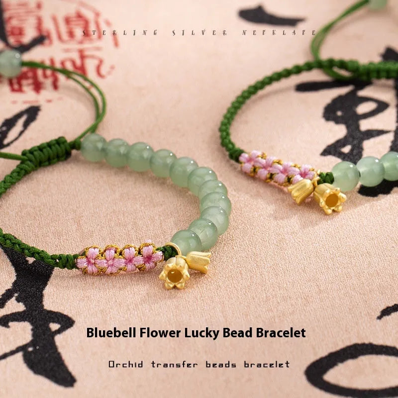 Red rope hand woven women's bracelet with floral design in Lily carrying strap colour